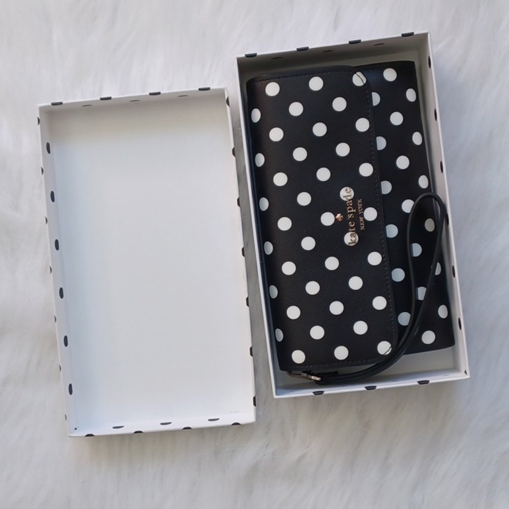 Kate Spade medium flap phone wristlet.  Cheers charming dots print.